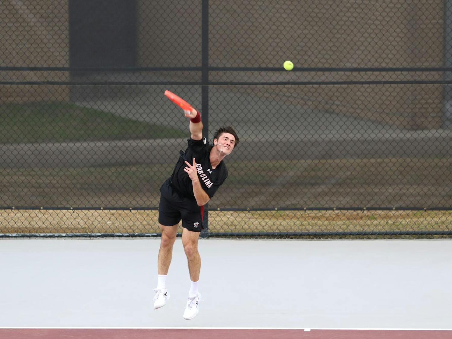 Sophomore Atakan Karahan serves during his singles match against Longhorn freshman Abel Forger Feb. 27, 2026. Karahan fell to Forger, 6-2, 6-2.