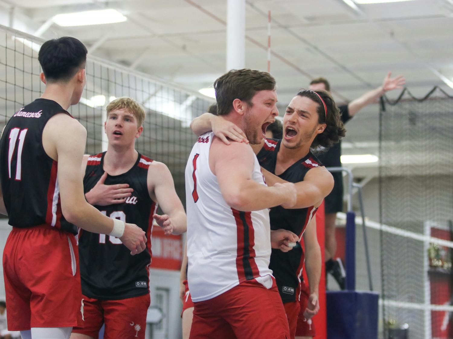 Senior libero Patrick Ertel and junior libero Brandon Keaney celebrate a hard earned point with the Garnet team. In this tournament match against Coastal Carolina A, the Garnet team saw a strong start, but ultimately lost 25-20. 