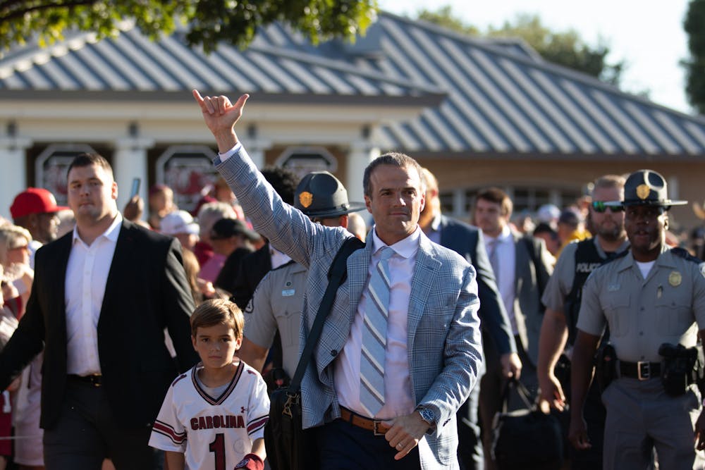 <p>FILE—Head coach Shane Beamer throws up the ‘Spurs Up’ hand sign to fans during the Gamecock Walk on Sept. 24, 2022. The Gamecock Walk is a game day tradition that takes place outside of Williams-Brice Stadium two hours and 30 minutes prior to kick-off.&nbsp;</p>