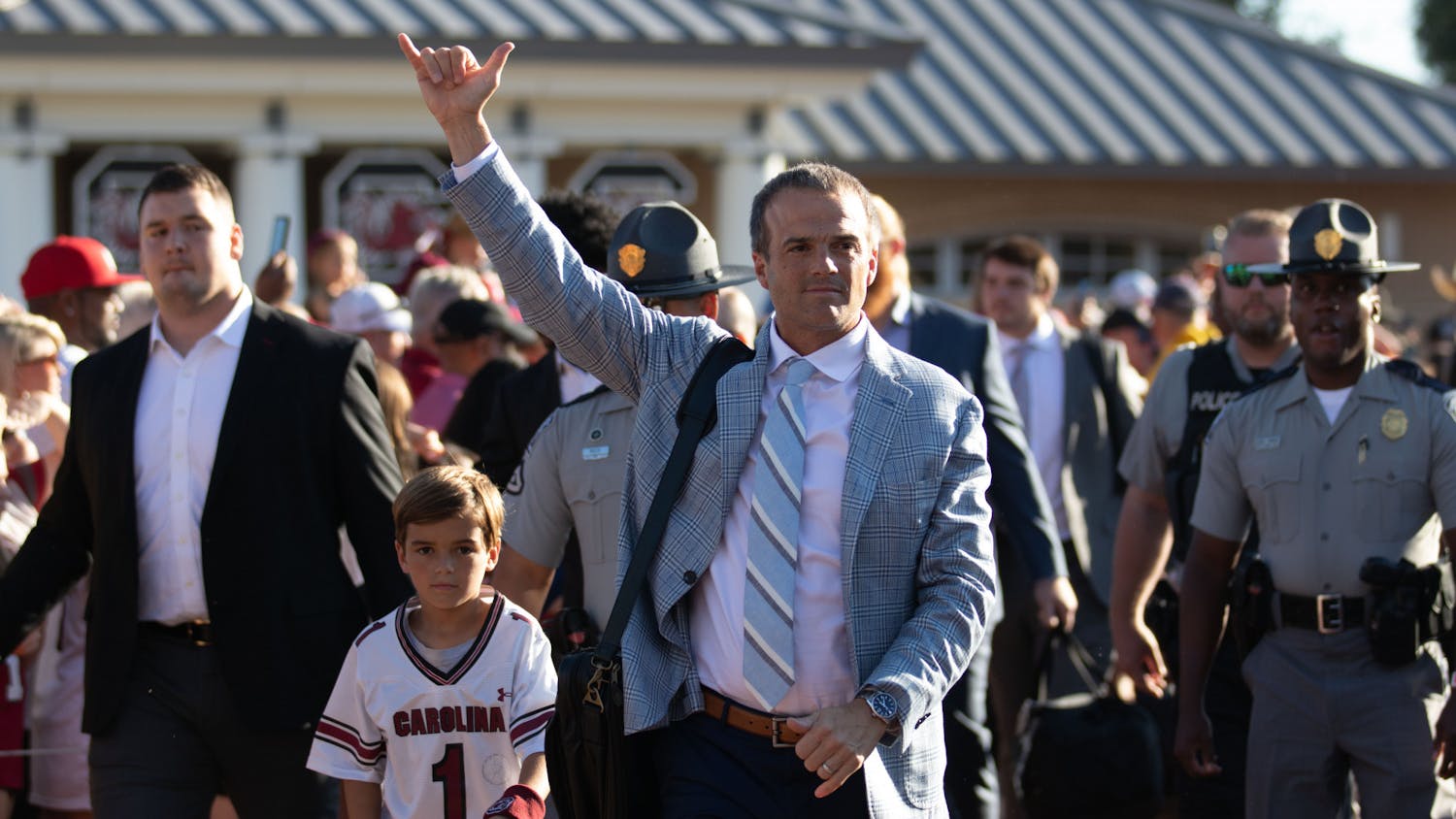 FILE—Head coach Shane Beamer throws up the ‘Spurs Up’ hand sign to fans during the Gamecock Walk on Sept. 24, 2022. The Gamecock Walk is a game day tradition that takes place outside of Williams-Brice Stadium two hours and 30 minutes prior to kick-off.&nbsp;
