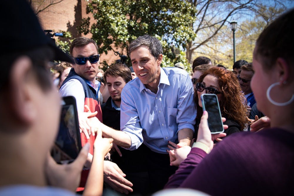 <p>2020 presidential candidate Beto O’Rourke engages crowds while leaving the Russell House patio.</p>