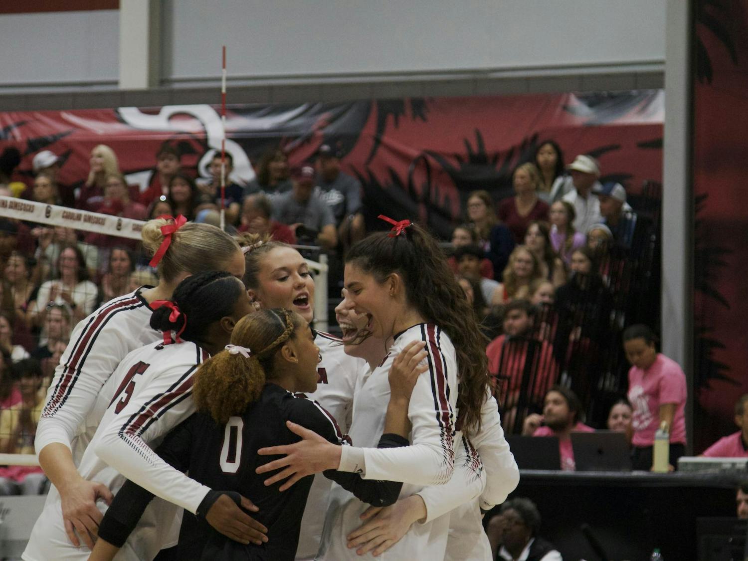Teammates take a moment to celebrate a point against the Mississippi State Bulldogs during one of their sets. The Gamecocks have averaged about 12 kills per set in the 2025 season. 