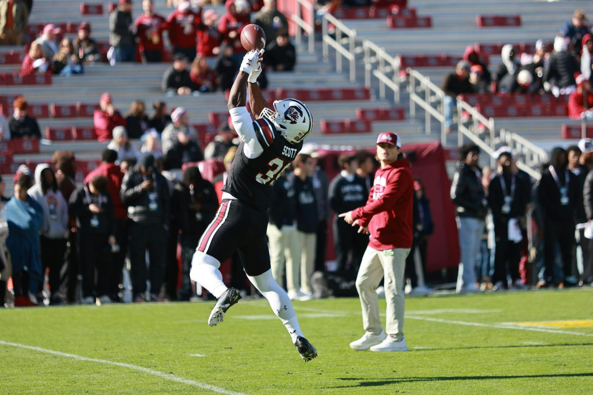 Freshman defensive back Chris Hatfield leaps to catch a pass during warmups before USC’s matchup against Clemson on Nov. 29, 2025, at Williams-Brice Stadium. Hatfield participates in pregame drills as the Gamecocks prepare to take the field for the rivalry game.