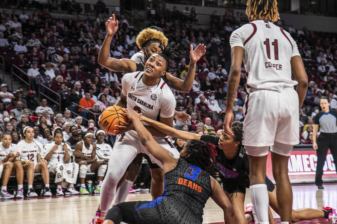 Freshman forward Ashlyn Watkins tries to maintain possession of the ball as the Gator's defense closes in during the second half of the game at Colonial Life Arena on Feb. 16, 2023. The Gamecocks beat the Gators 87-56.