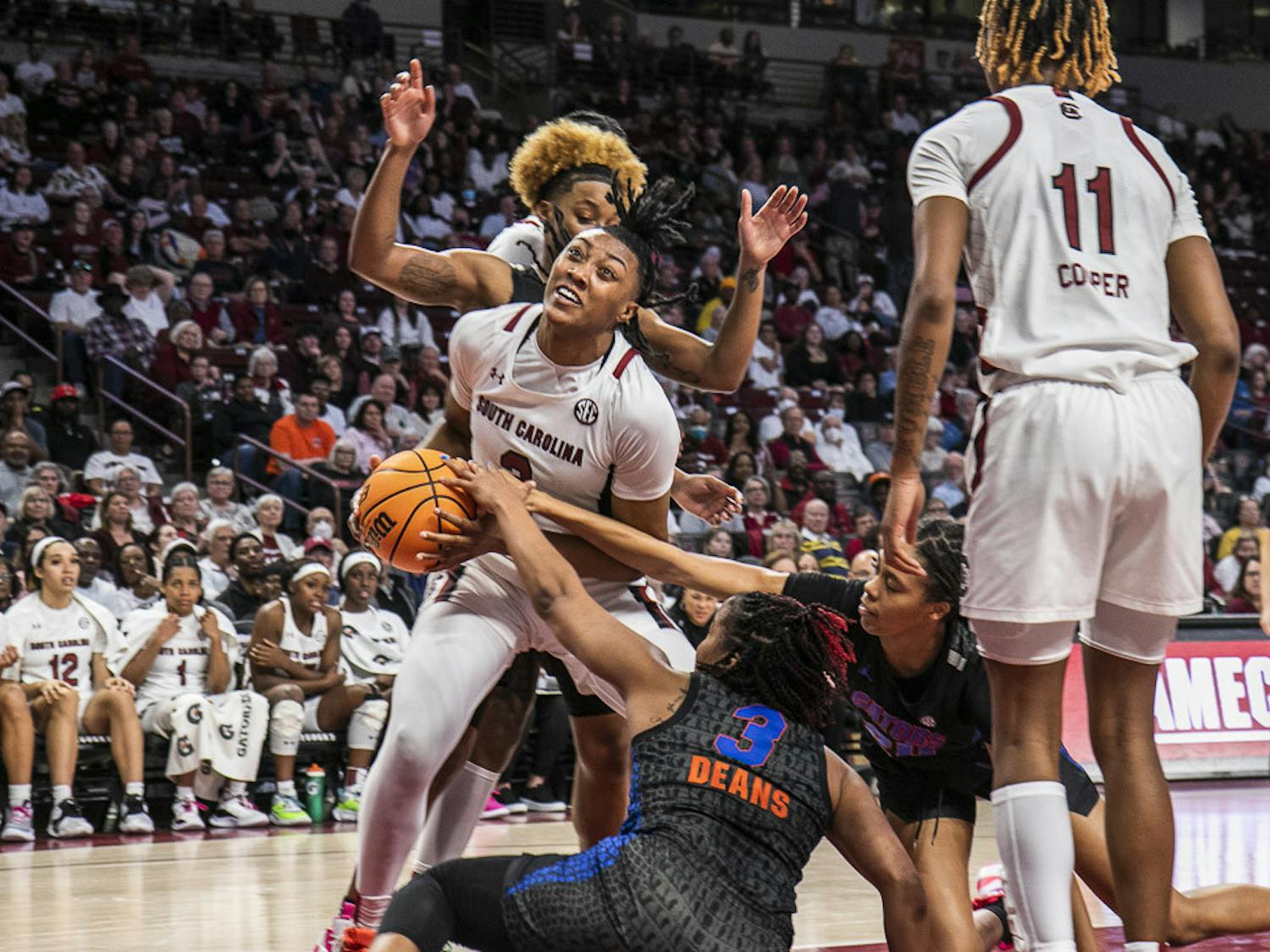 Freshman forward Ashlyn Watkins tries to maintain possession of the ball as the Gator's defense closes in during the second half of the game at Colonial Life Arena on Feb. 16, 2023. The Gamecocks beat the Gators 87-56.