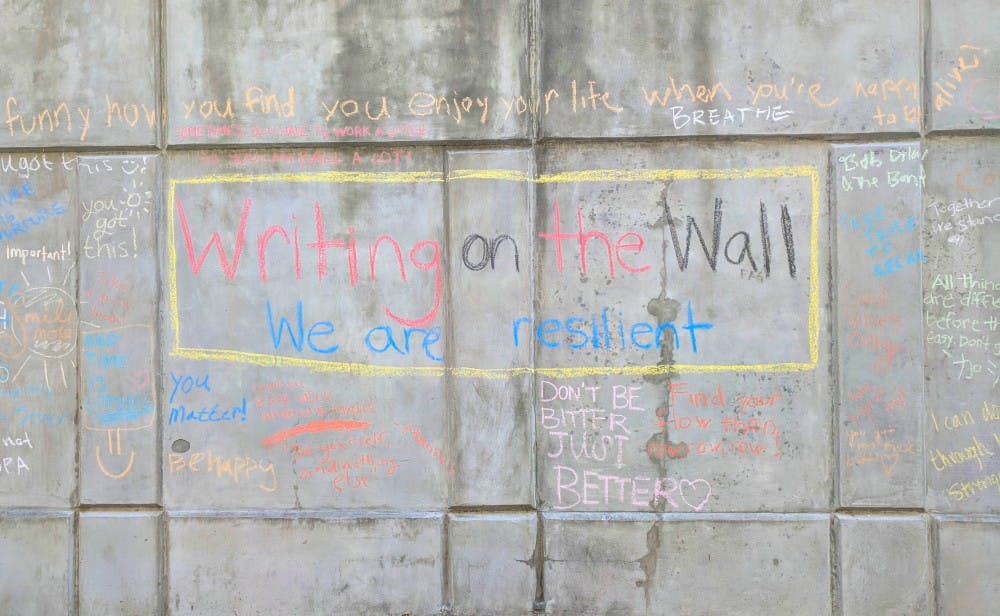 On the wall outside the Honors Residence Hall, students wrote messages of encouragement.