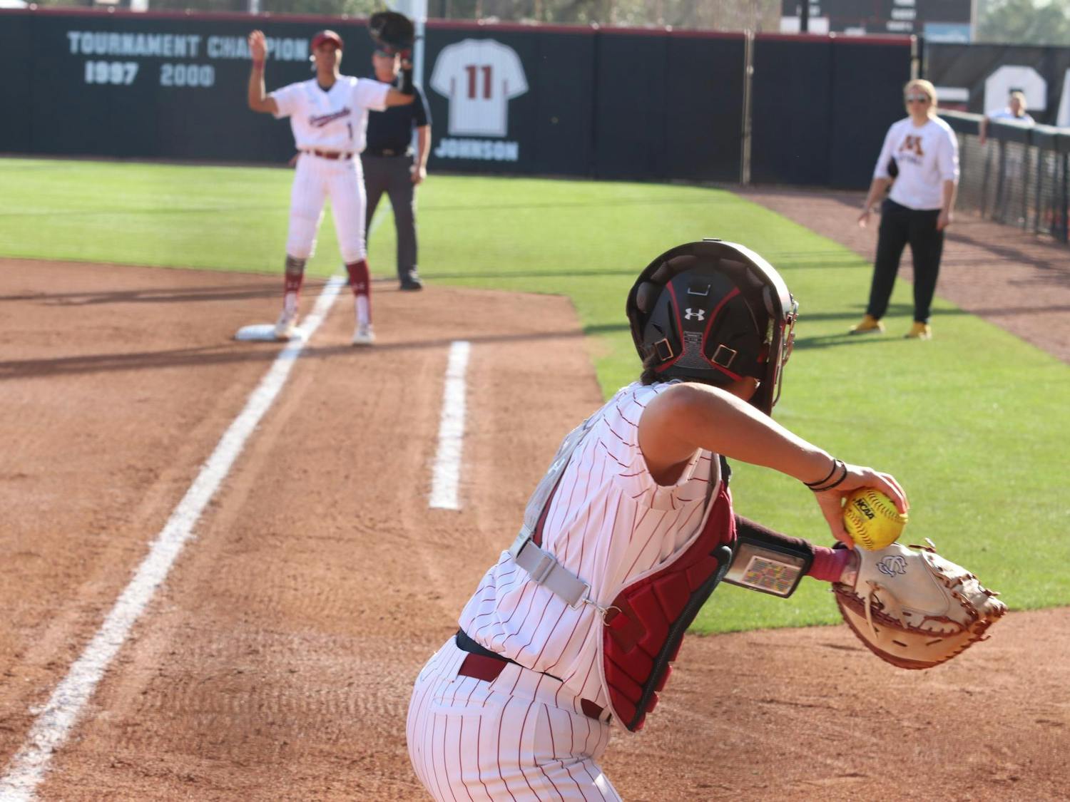 Senior catcher Jen Cummings throws to first base in South Carolina's game against Minnesota on March 16, 2024. Cummings has 131 putouts on the season.&nbsp;