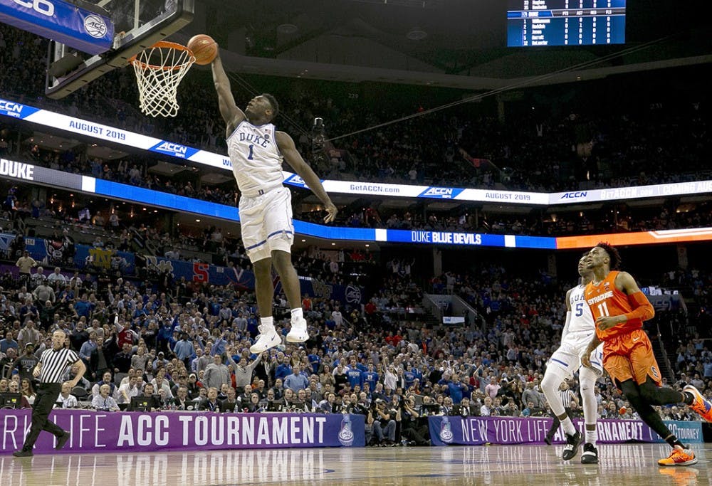 Duke&apos;s Zion Williamson (1) glides to the basket for a dunk in the opening minutes of play against Syracuse in the quarterfinals of the ACC Tournament at the Specturm Center in Charlotte, N.C., on Thursday, March 14, 2019. (Robert Willett/Raleigh News &amp; Observer/TNS)