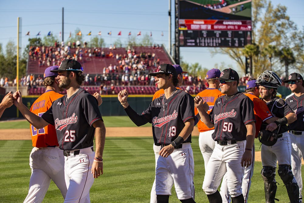 <p>FILE—South Carolina and Clemson players congratulate one another after the last game of the series on Mar. 5, 2023, at Founder's Park. The Gamecocks beat the Tigers 7-1; winning 2-1 in the series.&nbsp;</p>