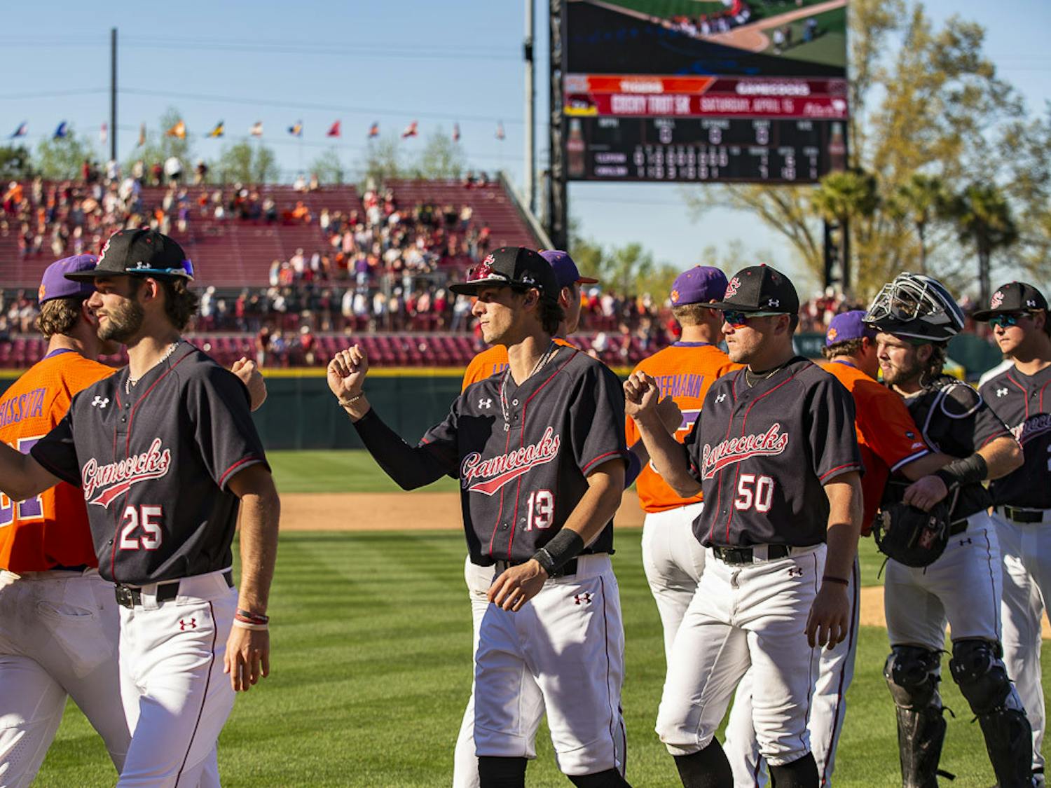 FILE—South Carolina and Clemson players congratulate one another after the last game of the series on Mar. 5, 2023, at Founder's Park. The Gamecocks beat the Tigers 7-1; winning 2-1 in the series.&nbsp;