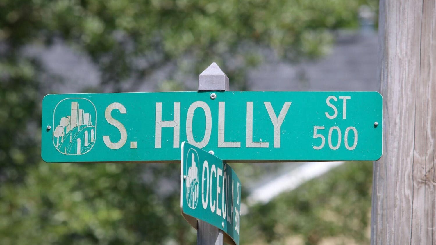 FILE — A photo of the street signs at the intersection of South Holly Street and Oceola Street on Saturday, Aug. 26, 2023. A USC student was fatally shot and killed in the 500 block of South Holly Street early Saturday morning.