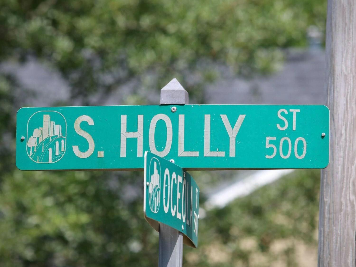 FILE — A photo of the street signs at the intersection of South Holly Street and Oceola Street on Saturday, Aug. 26, 2023. A USC student was fatally shot and killed in the 500 block of South Holly Street early Saturday morning.