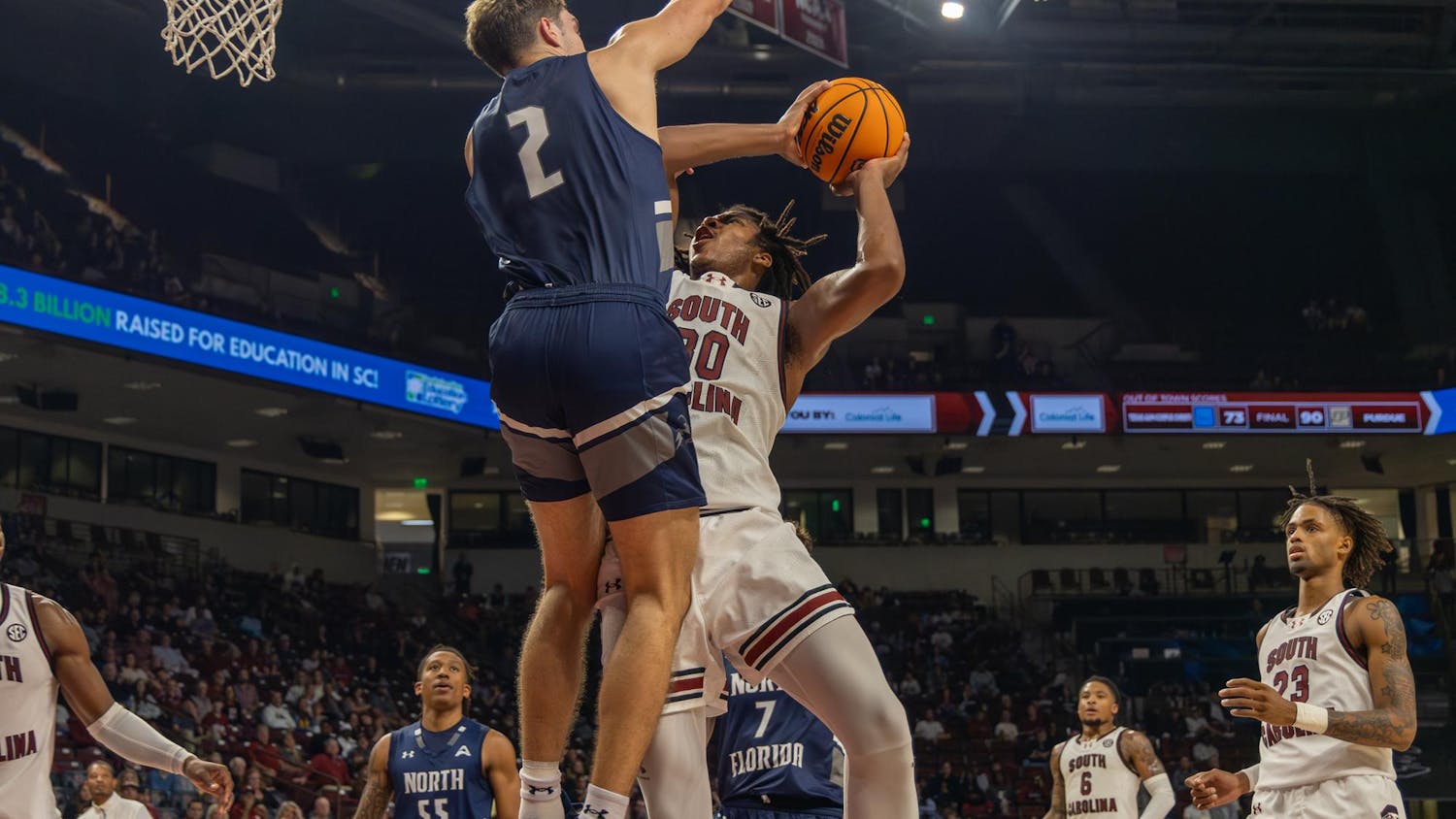 A University of North Florida guard blocks sophomore forward Collin Murray-Boyles from scoring during South Carolina's season opener on Nov. 4, 2024 at Colonial Life Arena. The Gamecocks lost to the Ospreys 71-74 after leading for 28 minutes of the game.
