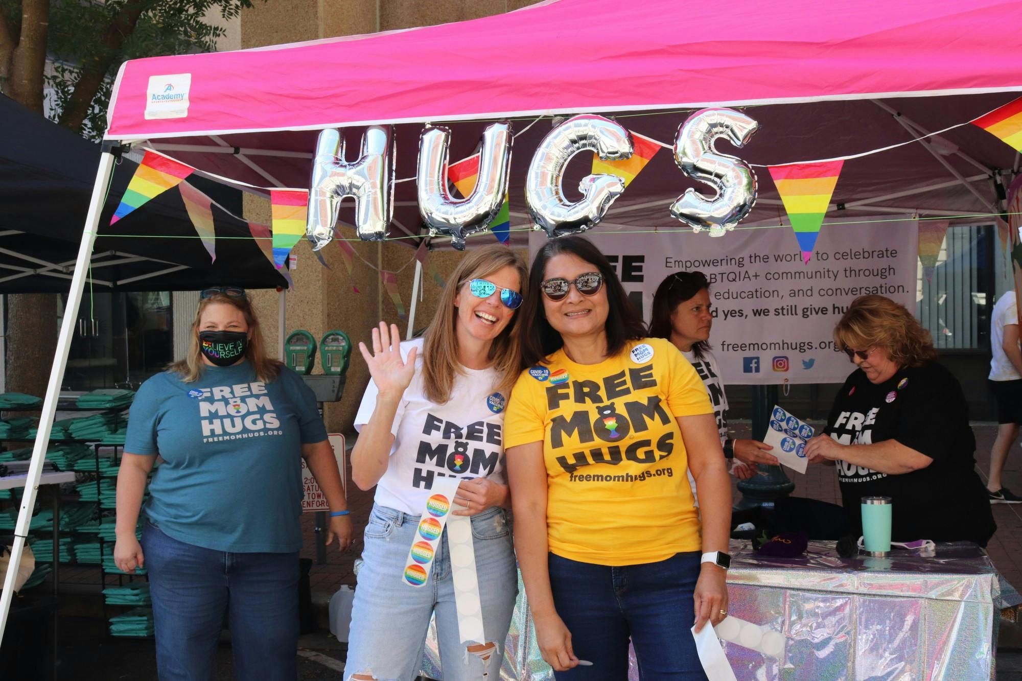 A group of women give out “free mom hugs,” offering a welcoming shoulder for LGBTQIA+ community members at the 2021 South Carolina Pride Festival, an event dedicated to celebrating the LGBTQIA+ community and advocating for LGBTQIA+ equality.
