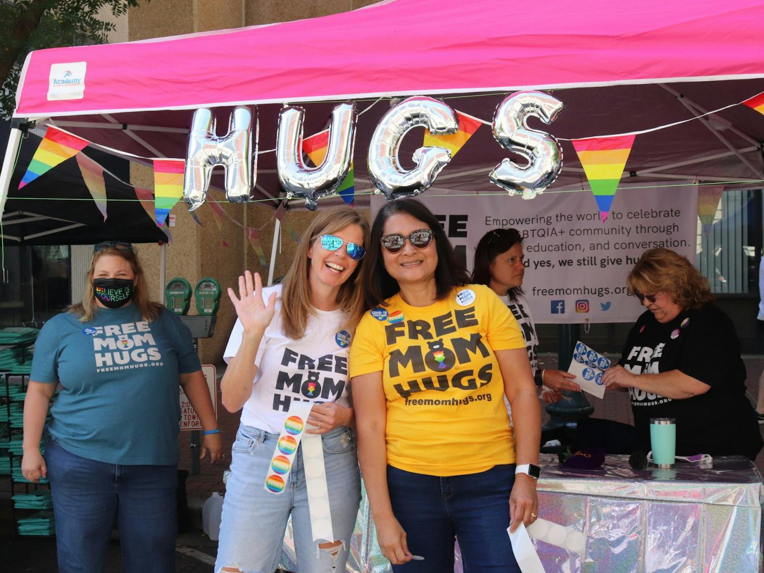 A group of women give out “free mom hugs,” offering a welcoming shoulder for LGBTQIA+ community members at the 2021 South Carolina Pride Festival, an event dedicated to celebrating the LGBTQIA+ community and advocating for LGBTQIA+ equality.