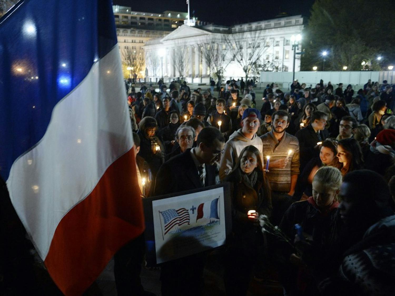 A crowd gathers for a vigil in honor of the victims of terrorist attacks in Paris at Lafayette Square, outside the White House, on Saturday, Nov. 14, 2015, in Washington, D.C. People gathered in cities around the world to show support for Paris following the coordinated assault that left at least 129 people killed and more than 350 injured. (Olivier Douliery/Abaca Press/TNS)