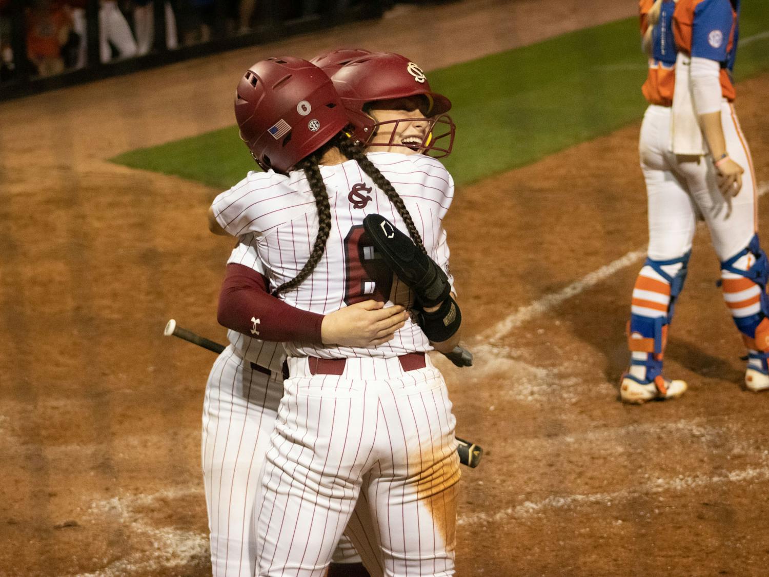 Fifth-year infielder Jordan Fabian hugs sophomore infielder Emma Sellers after scoring in their game against Florida on March 31, 2023, at Beckham Field. The Gamecocks beat the Gators 13-10, winning the first game in the series.