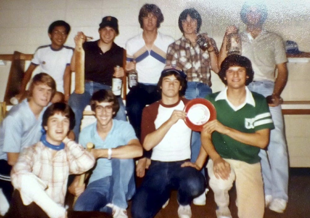 <p>Then-second-year journalism student John Straubinger (kneeling, with glasses) poses with residents of Bates House's fifth floor in 1980.</p>