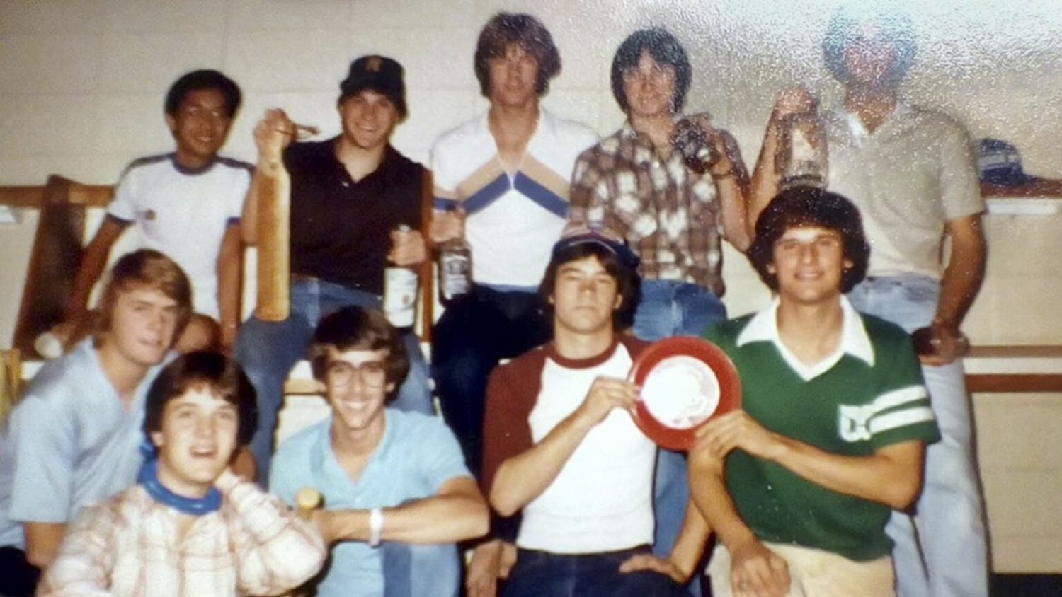 Then-second-year journalism student John Straubinger (kneeling, with glasses) poses with residents of Bates House's fifth floor in 1980.