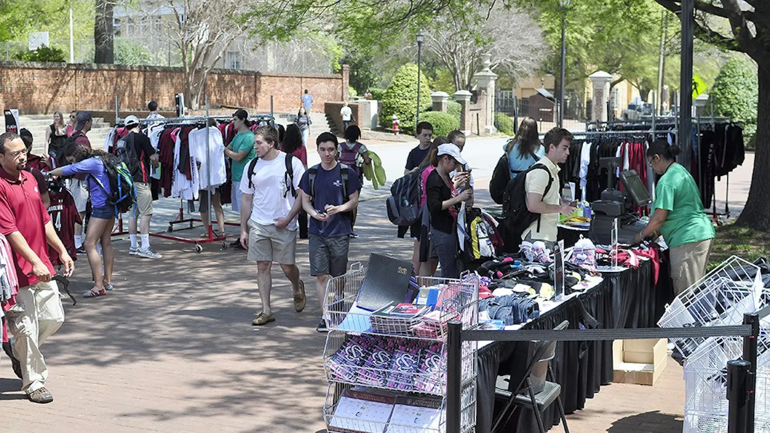 Members of the USC Fashion Board sell T-shirts and hair ties designed by students, as well as tickets to Thursday’s fashion show on Greene Street Monday.