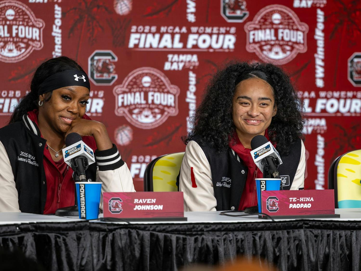 Junior guard Raven Johnson (left) and senior guard Te-Hina Paopao (right) smile during a press conference at Amalie Arena on April 3, 2025. Johnson and Paopao were both on the team for South Carolina's 2024 National Championship run.