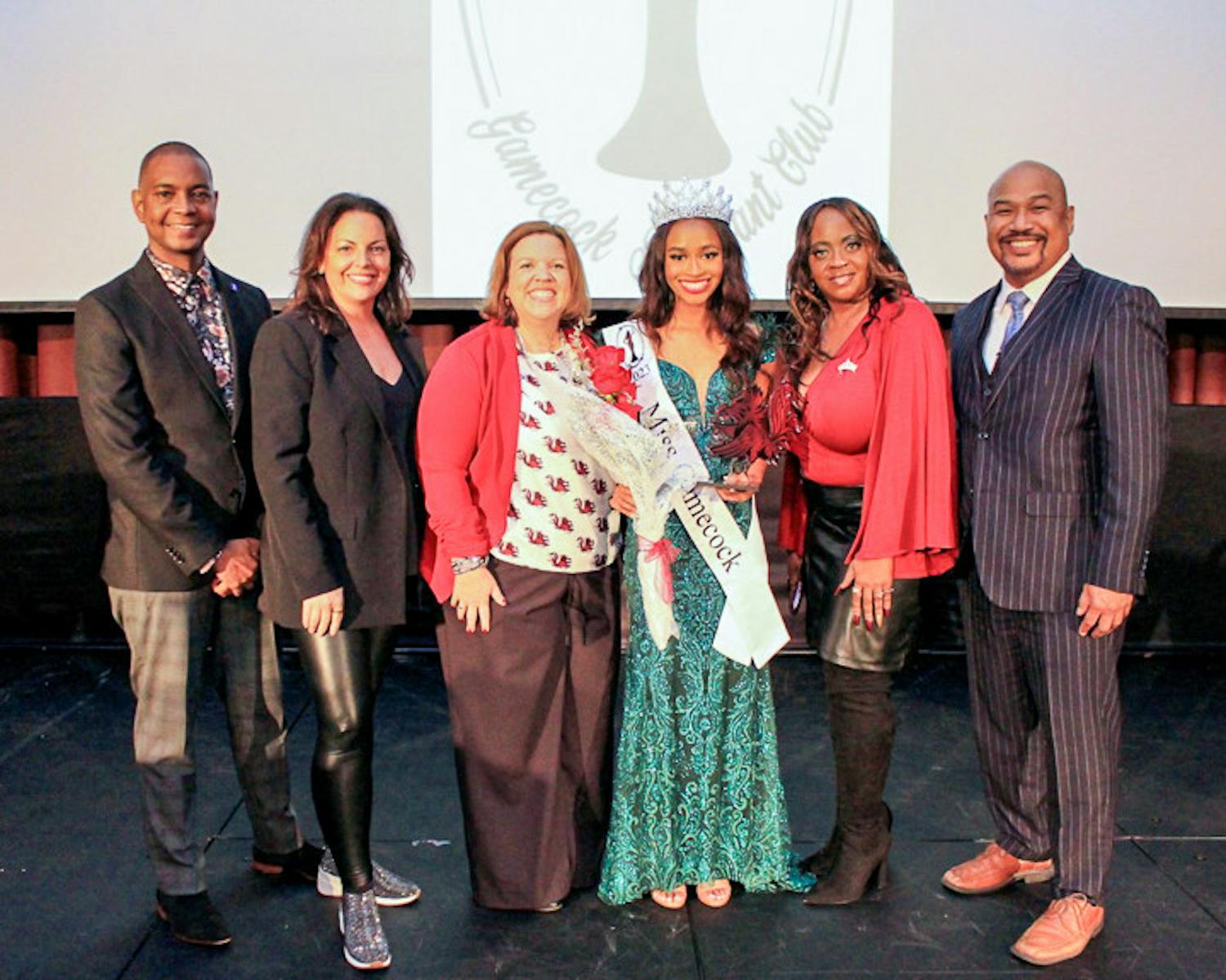 Third-year retail student Jordyn Lewis (center, right) stands amongst judges after winning the Miss Gamecock pageant on Nov. 12, 2022. This was Lewis' first time entering the pageant, and she is the second Black woman to win the contest in  history.