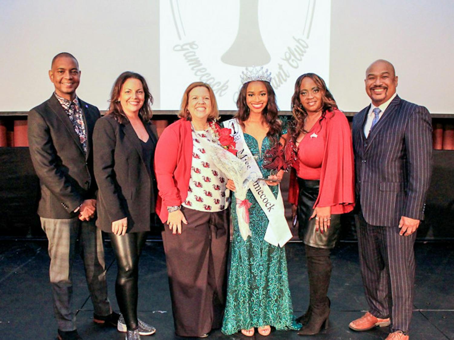 Third-year retail student Jordyn Lewis (center, right) stands amongst judges after winning the Miss Gamecock pageant on Nov. 12, 2022. This was Lewis' first time entering the pageant, and she is the second Black woman to win the contest in USC history.