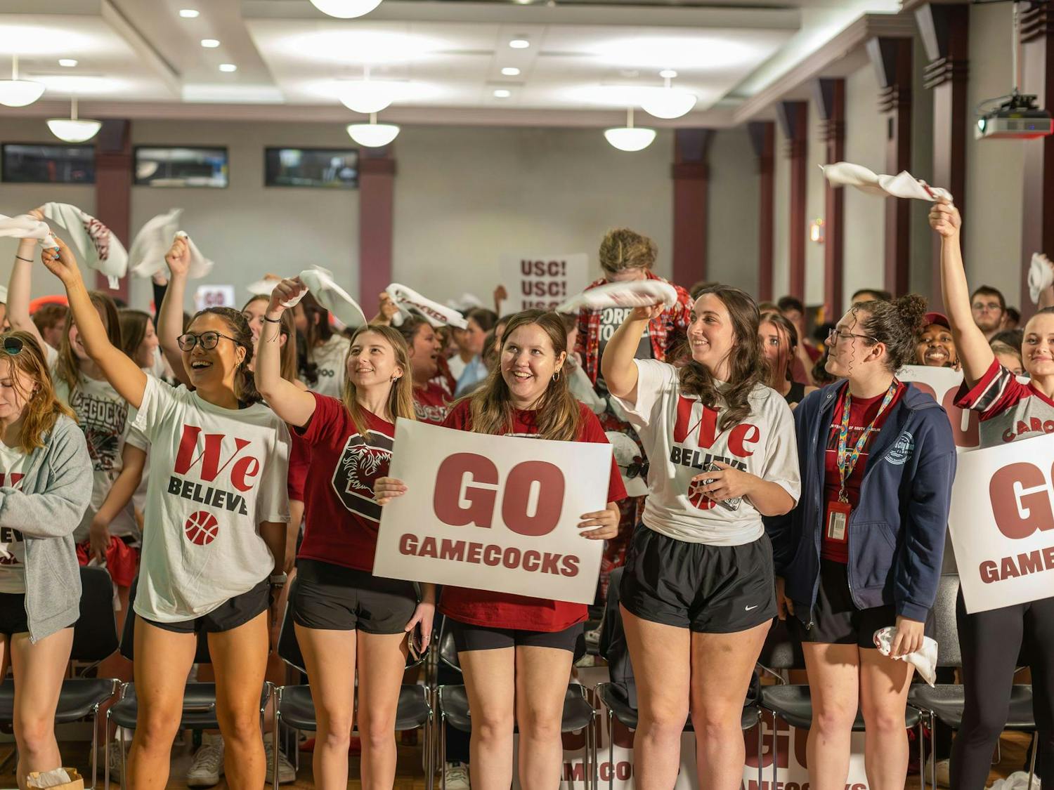 University of South Carolina students gather in the Russell House Student Union to cheer on the Gamecock women's basketball team as it competes in the final round of the NCAA Women's Tournament against Iowa on April 7, 2024. The Gamecocks defeated the Hawkeyes 87-75 and claimed Dawn Staley's third national title as head coach.