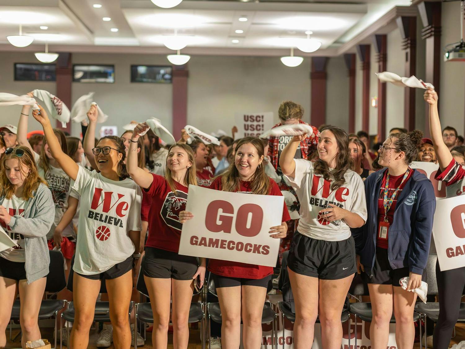 University of South Carolina students gather in the Russell House Student Union to cheer on the Gamecock women's basketball team as it competes in the final round of the NCAA Women's Tournament against Iowa on April 7, 2024. The Gamecocks defeated the Hawkeyes 87-75 and claimed Dawn Staley's third national title as head coach.