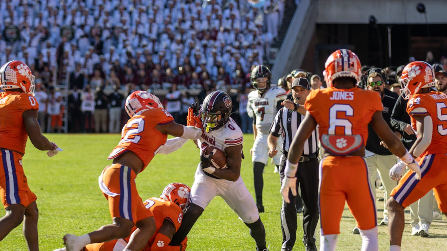 Junior tight end Jaheim Bell being pushed out of bounds by Clemson defense on Nov. 26, 2022 at Memorial Stadium. Bell rushed for a total of 29 yards during the game.