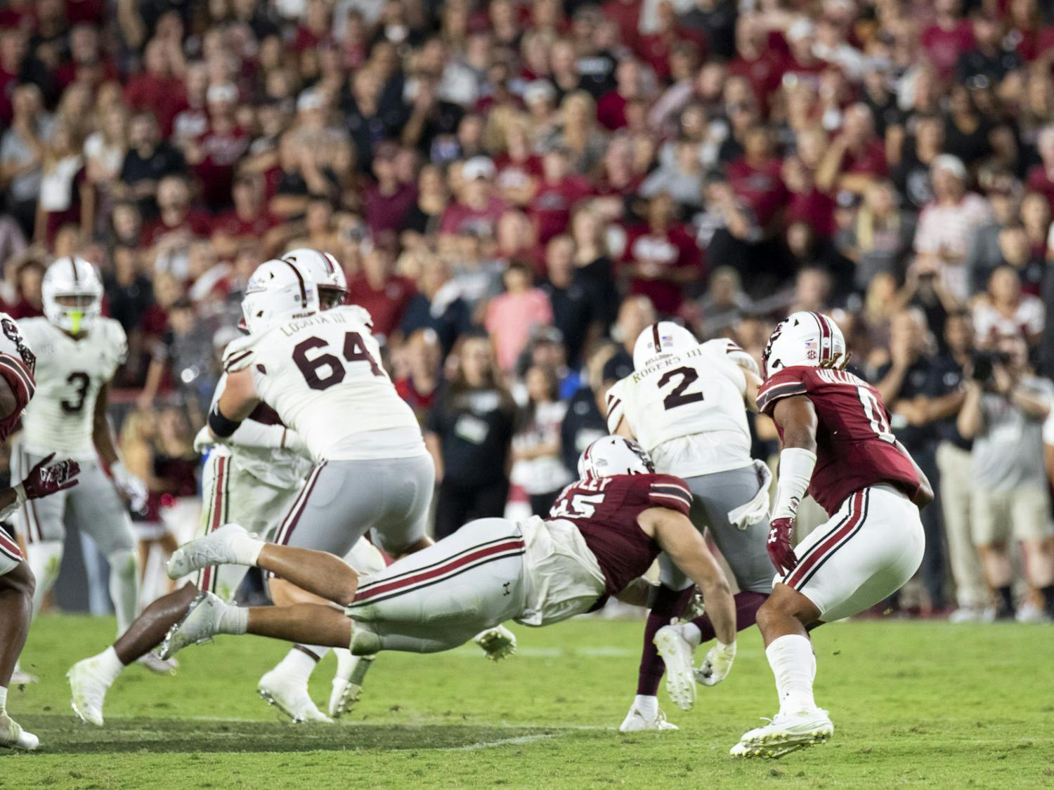 Redshirt junior defensive tackle Alex Huntley completes a sack on Mississippi State's quarterback at Williams-Brice Stadium on Sept. 23, 2023. Huntley was named one of the Gamecocks' captains for the match.