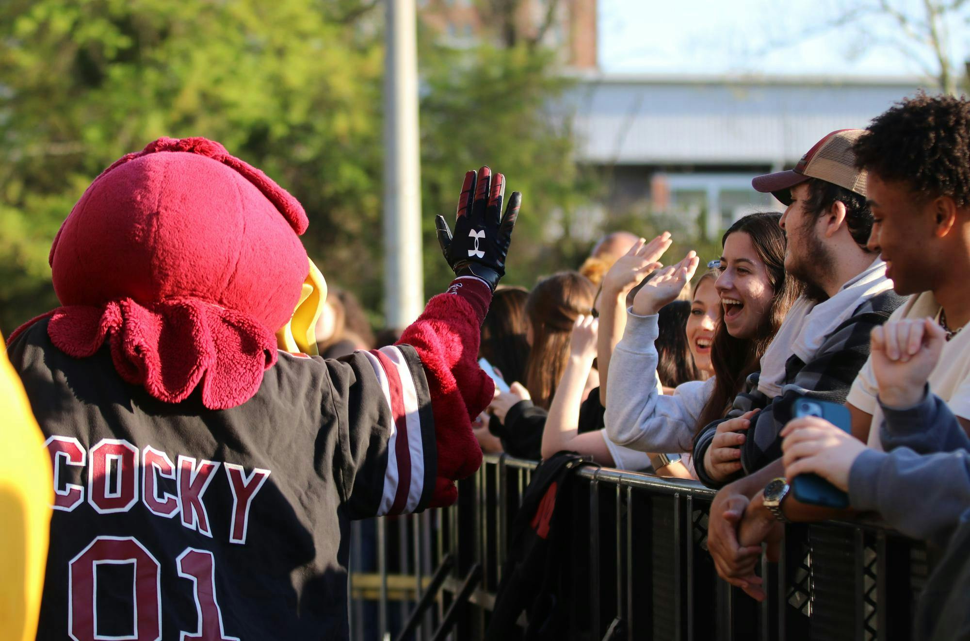 Cocky high-fives students waiting for the start of Cockstock at the University of South Carolina on March 24, 2026. The concert featured Weston Estate, Social House and Luh Tyler.