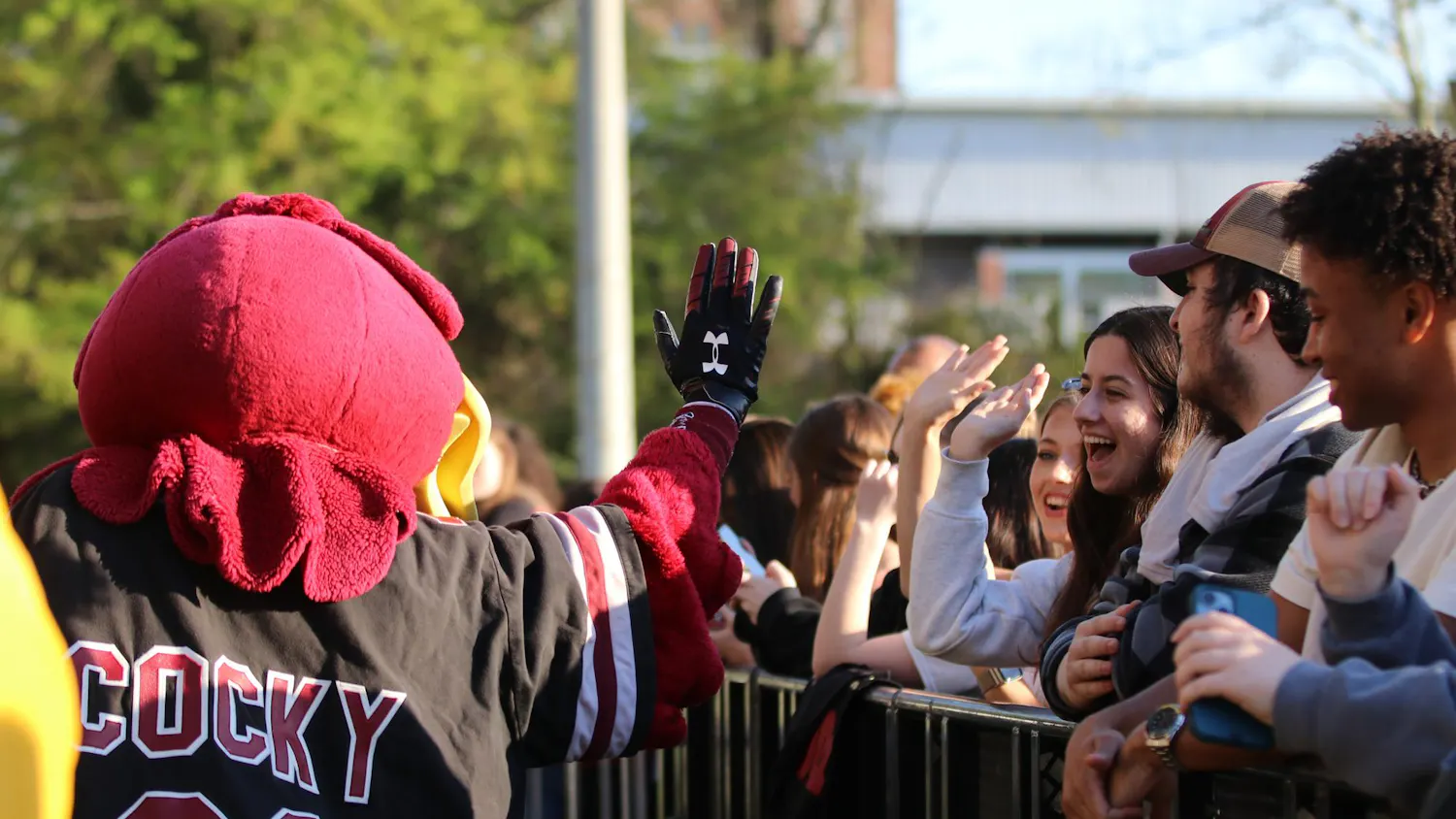 Cocky high-fives students waiting for the start of Cockstock at the University of South Carolina on March 24, 2026. The concert featured Weston Estate, Social House and Luh Tyler.