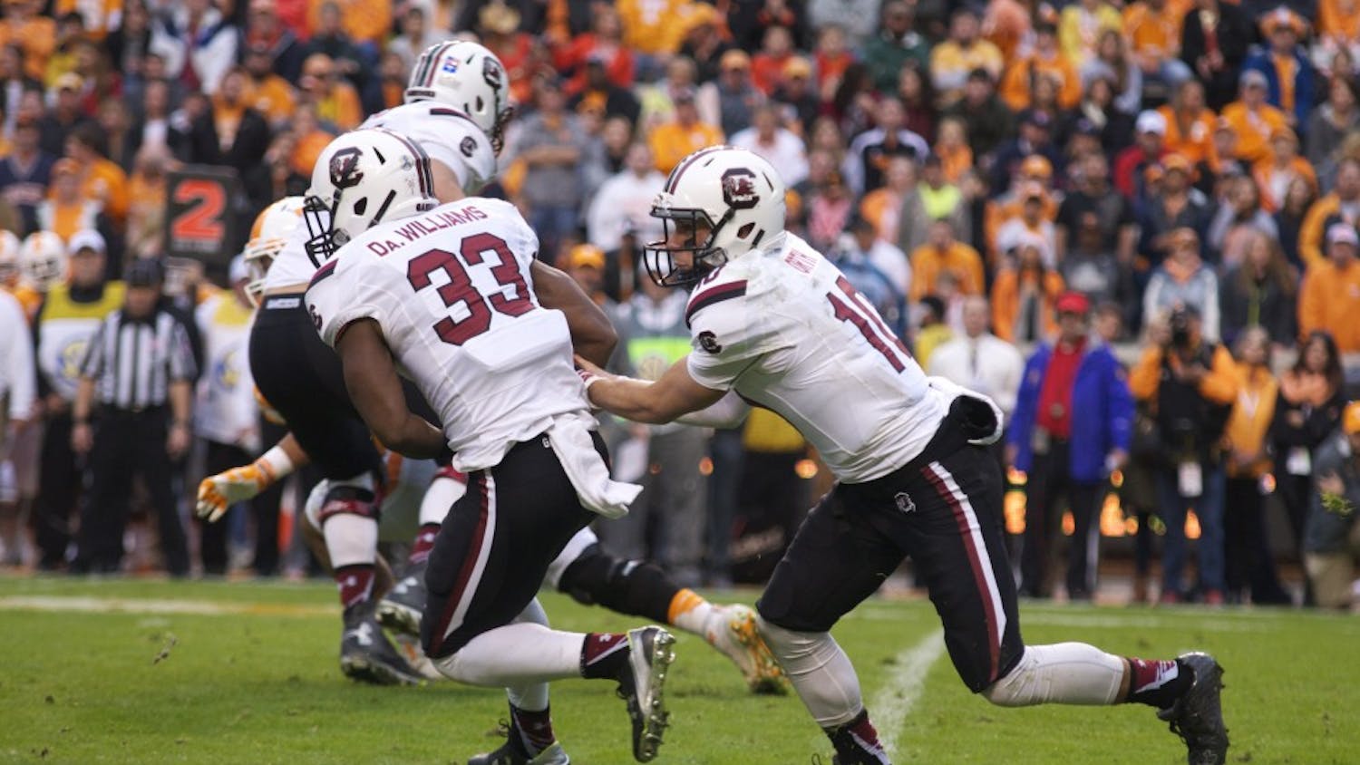 David Williams takes a handoff from Perry Orth in South Carolina's 27-24 loss to Tennessee on Nov. 7.