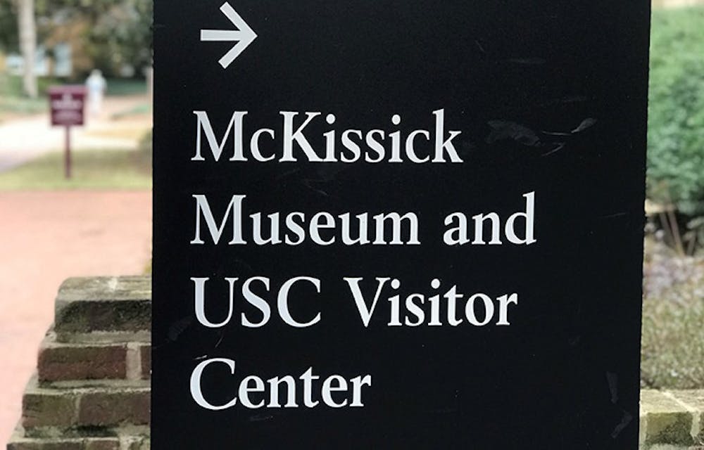 <p>&nbsp;A university sign points toward the direction of the McKissick Museum, which is located just off the Horseshoe. The museum has been home to multiple exhibits in the past but is currently home to "Child's Play,” which was created by Leslie Yarborough.</p>