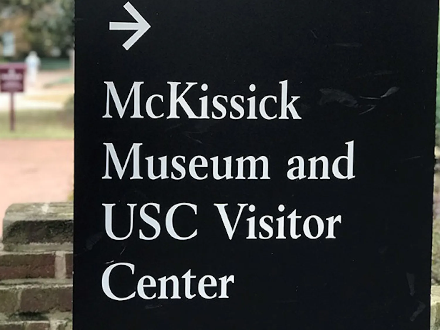  A university sign points toward the direction of the McKissick Museum, which is located just off the Horseshoe. The museum has been home to multiple exhibits in the past but is currently home to "Child's Play,” which was created by Leslie Yarborough.