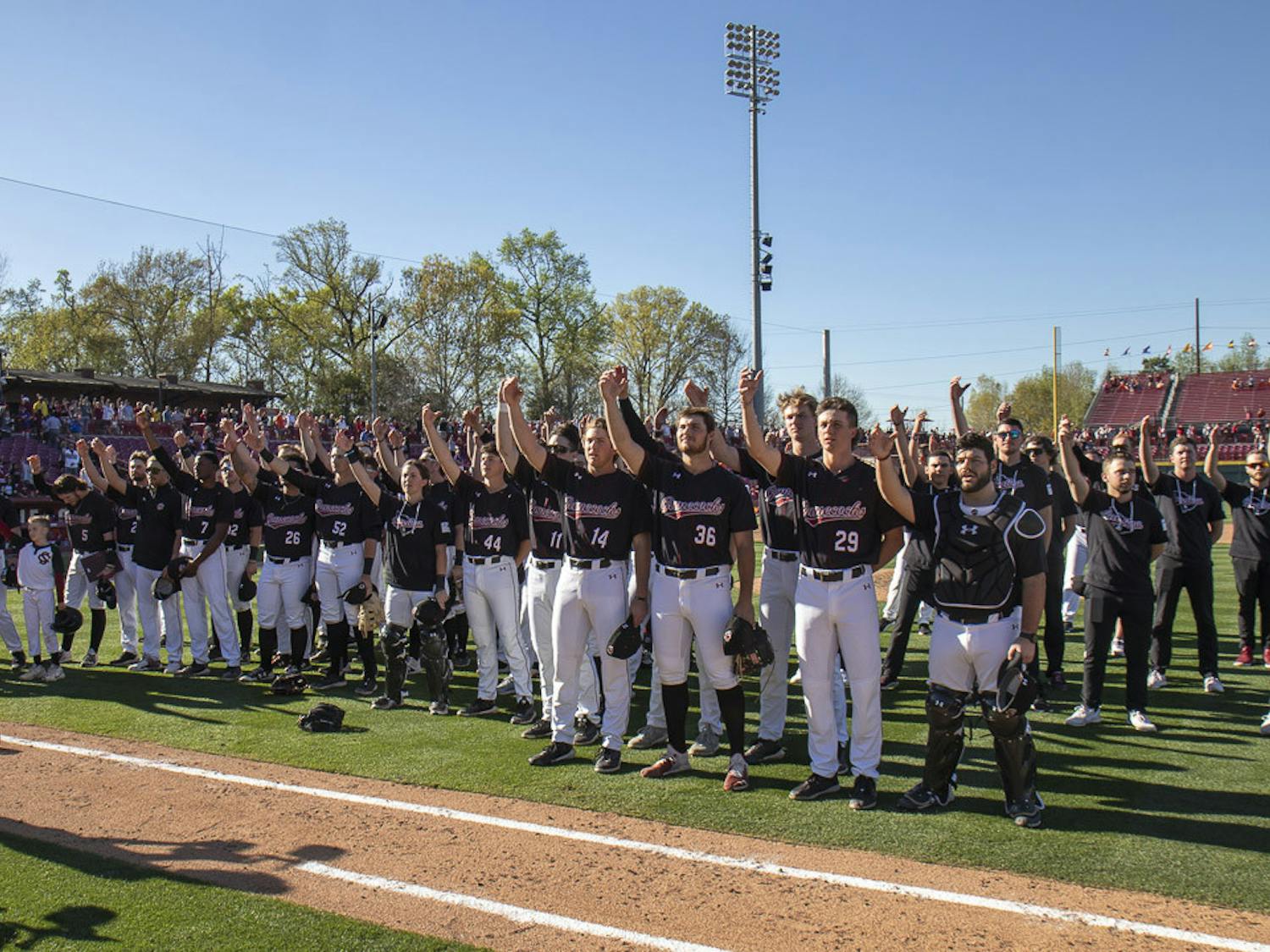 South Carolina players offer a toast during the playing of alma mater after their 7-1 win against Clemson on March 5, 2023. The Gamecocks beat the Tigers 2-1 in the series, putting it 11-1 in the season.