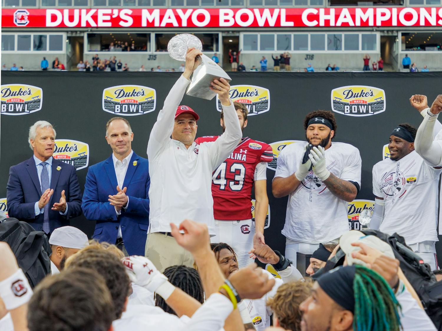 FILE—Head coach Shane Beamer holds up the Duke's Mayo Bowl Trophy on Dec. 30, 2022. The Gamecocks beat North Carolina 38-21.