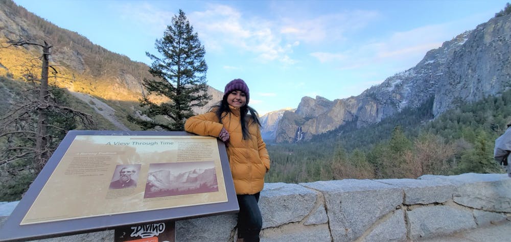 Nowrin Tamanna, a graduate epidemiology student, poses in front of Yosemite Valley.
