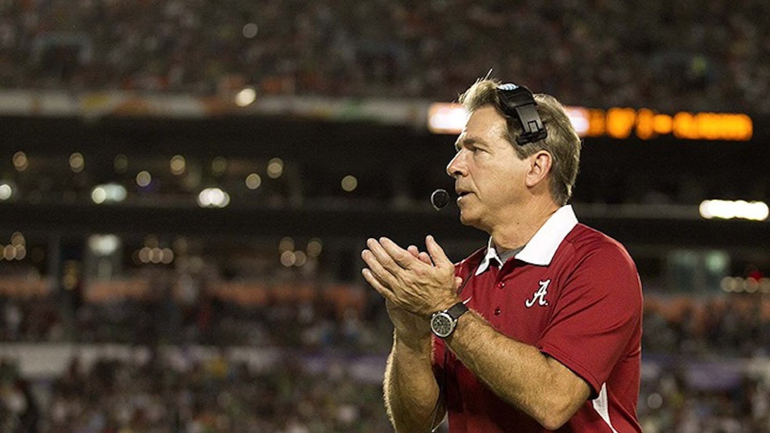 Alabama head coach Nick Saban applauds running back Eddie Lacy (42) after his second touchdown in the first half against Notre Dame in the BCS National Championship game at Sun Life Stadium on Monday, January 7, 2013, in Miami Gardens, Florida. (Allen Eyestone/Palm Beach Post/MCT)