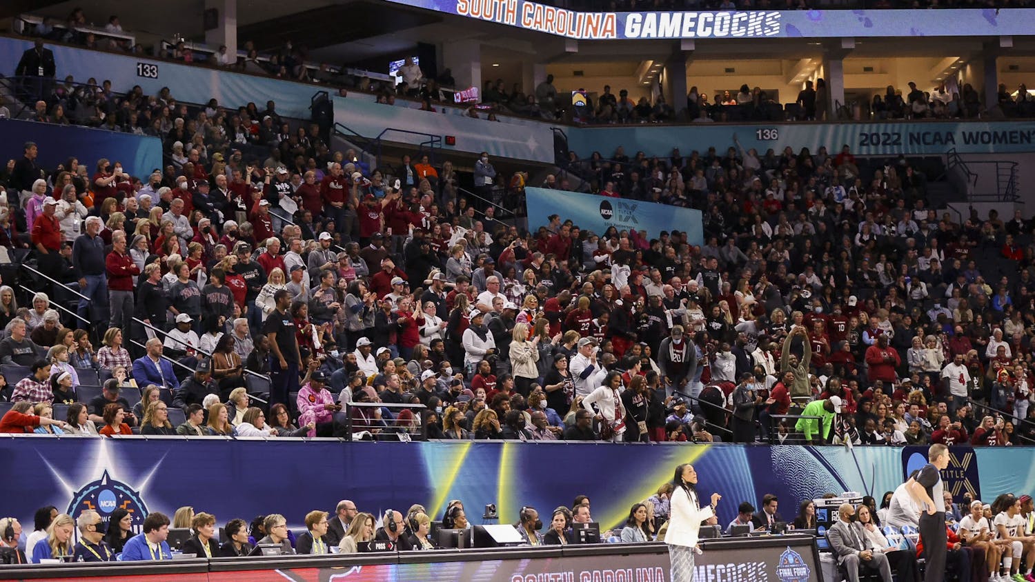 South Carolina fans filled the section behind the Gamecocks bench during South Carolina's 72-59 victory over Louisville on April 1, 2022. South Carolina advanced to play in the national championship game with the win.