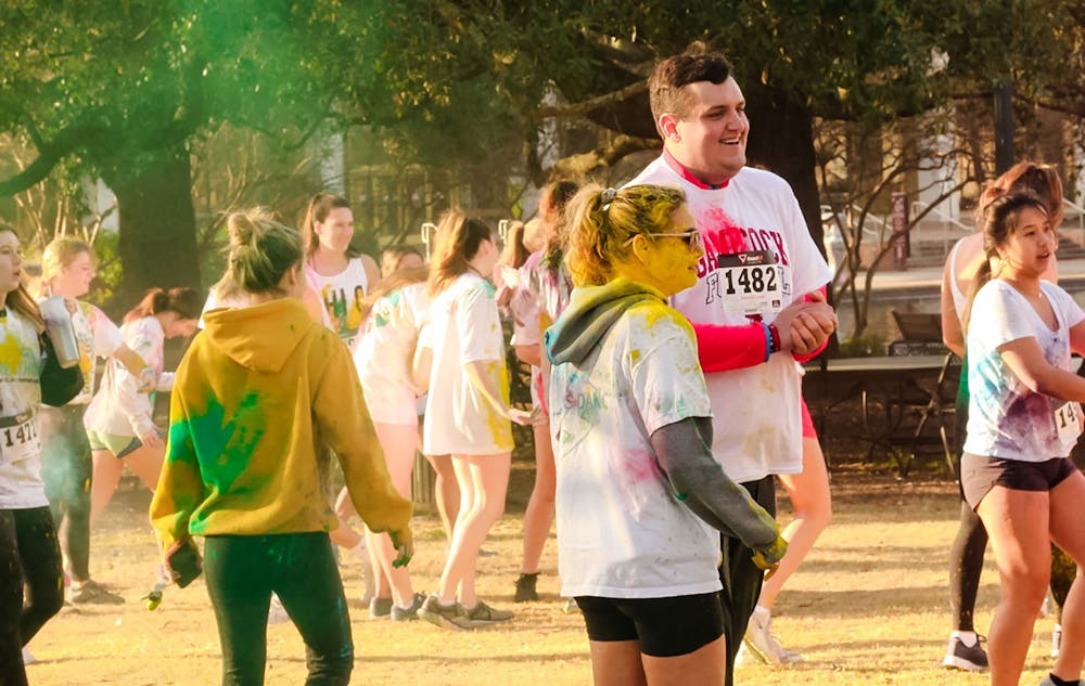 <p>Participants of USC Dance Marathon's annual 5K race ran covered in a different color powder as part of a "color run" paying tribute to the late "Miracle Kid" Eli Adams.</p>