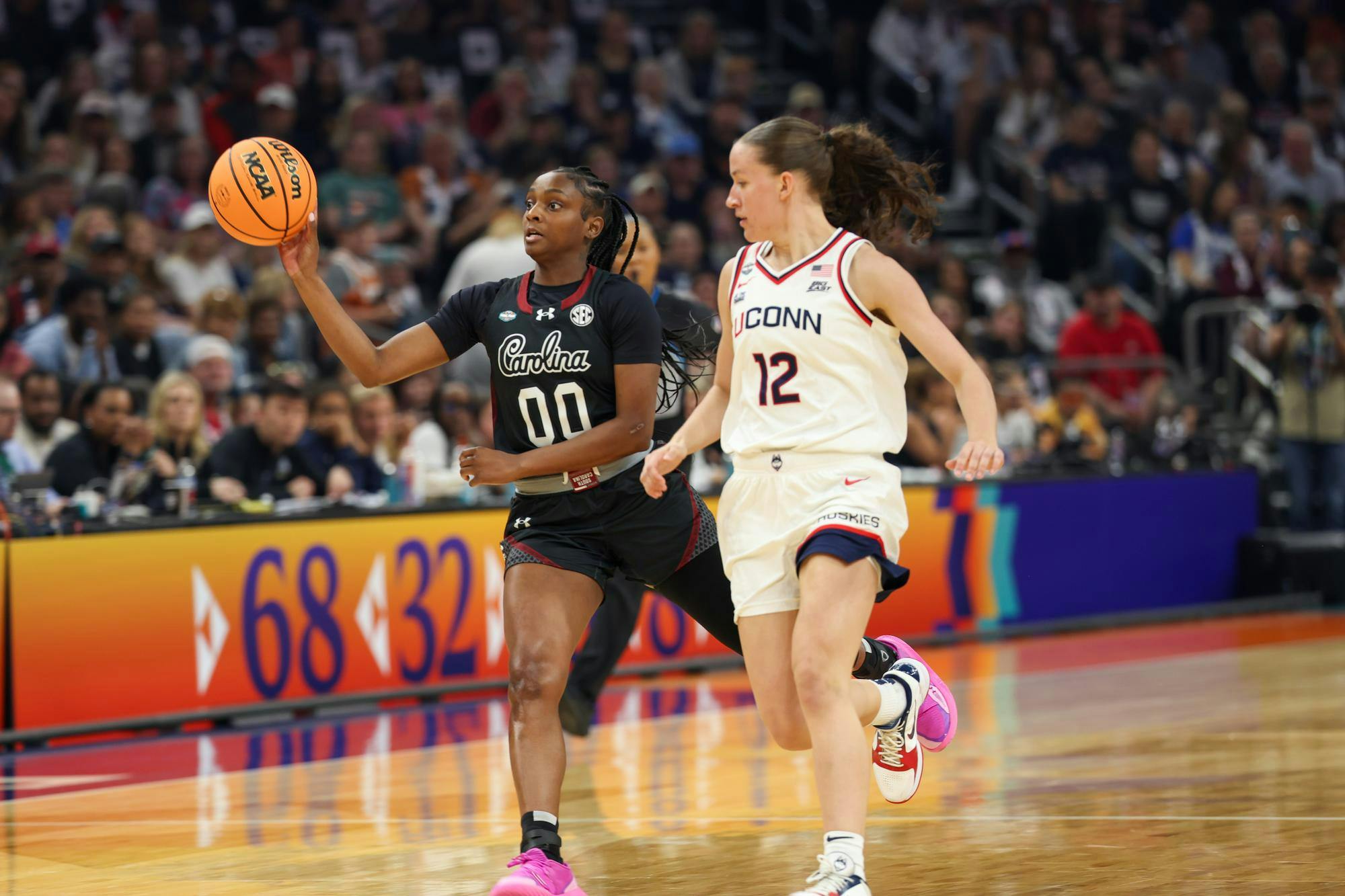 Senior guard Ta'Niya Latson passes the ball during the game against UConn at the March Madness semifinals on April 3, 2026. Latson had the most rebounds on the team, with 11 total.