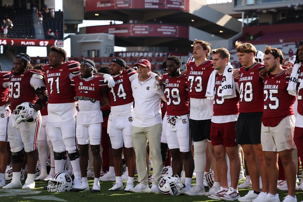 <p>The South Carolina football team stands with arms around each other during the Alma Mater after the game against Oklahoma on Oct. 18, 2025. The Gamecocks finished the season with a 4-8 win-loss ratio.</p>