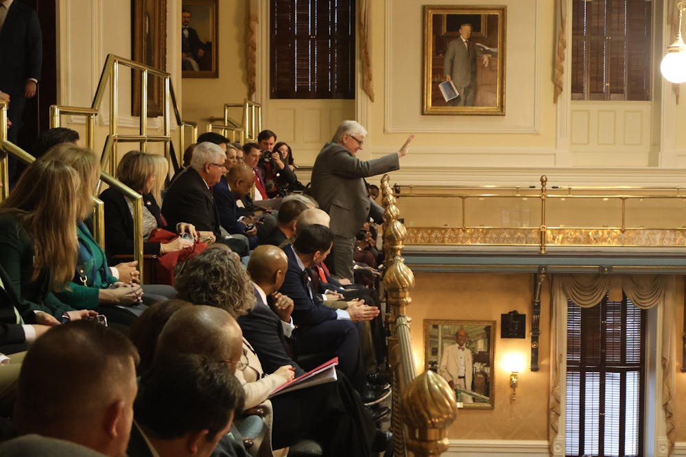 <p>University of South Carolina President Michael Amiridis waves to the South Carolina Senate at the Statehouse on Feb. 11, 2025. Amiridis, USC students and faculty visited the Statehouse as part of the annual Carolina Day.</p>