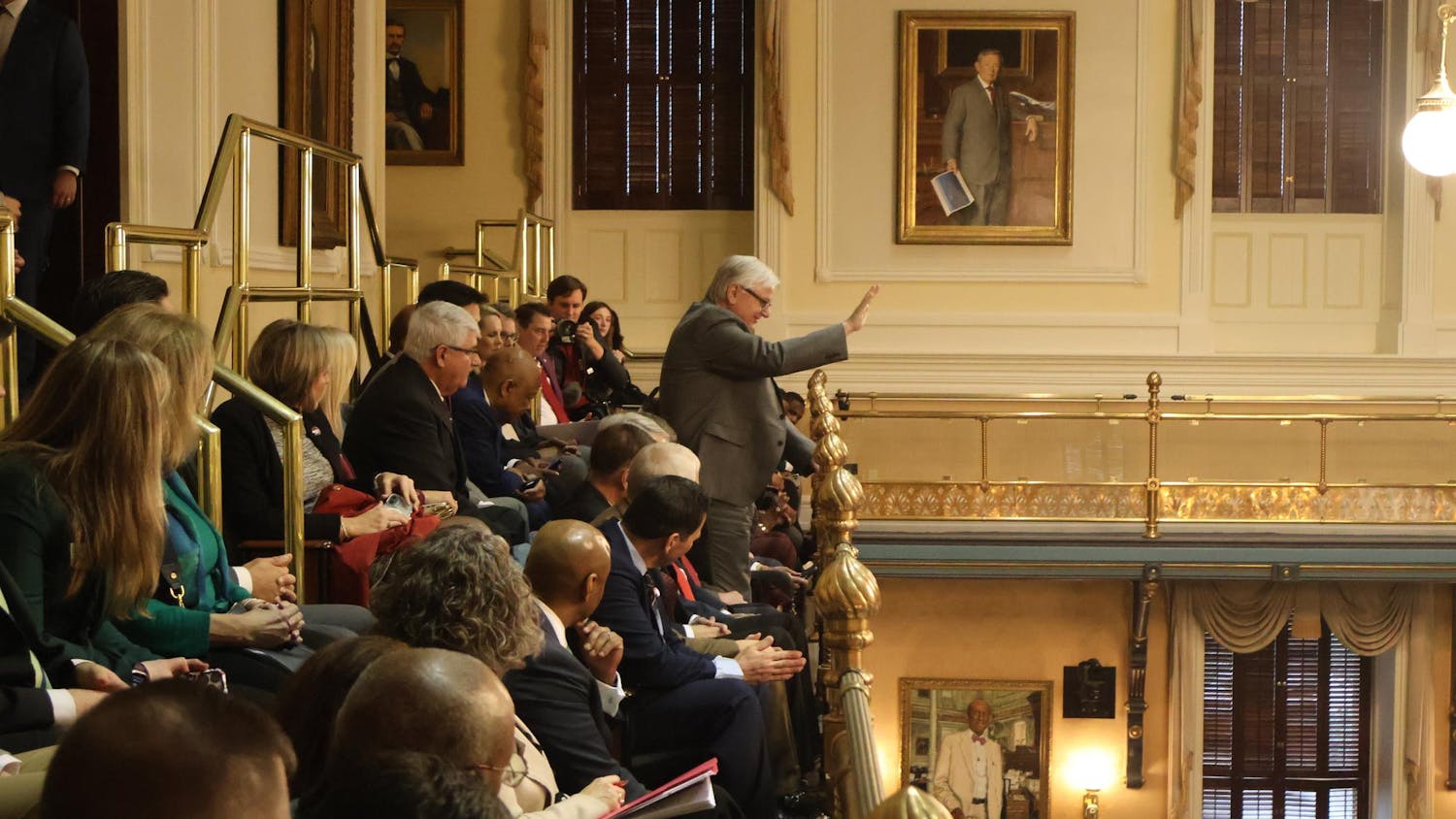 University of South Carolina President Michael Amiridis waves to the South Carolina Senate at the Statehouse on Feb. 11, 2025. Amiridis, USC students and faculty visited the Statehouse as part of the annual Carolina Day.