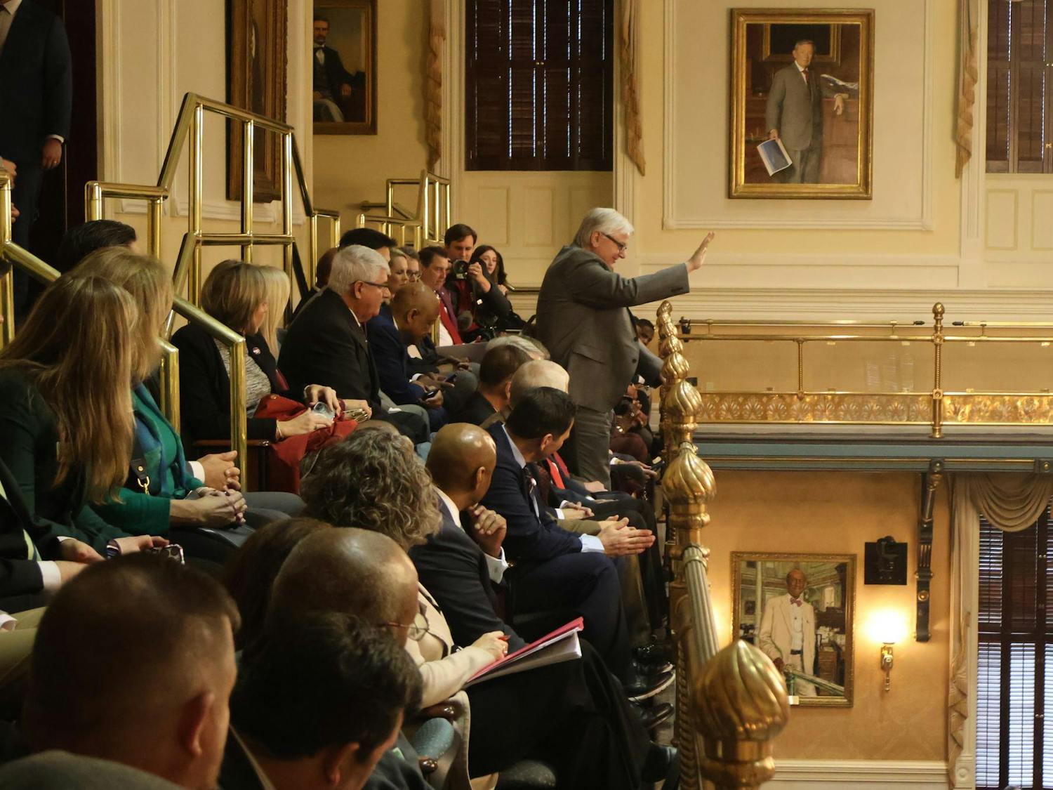 University of South Carolina President Michael Amiridis waves to the South Carolina Senate at the Statehouse on Feb. 11, 2025. Amiridis, USC students and faculty visited the Statehouse as part of the annual Carolina Day.