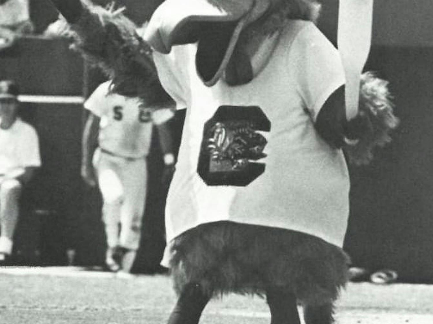 Cocky on the baseball field in the 1980s holding a toy baseball bat. He took on a goofy personality that kept the crowd entertained.&nbsp;