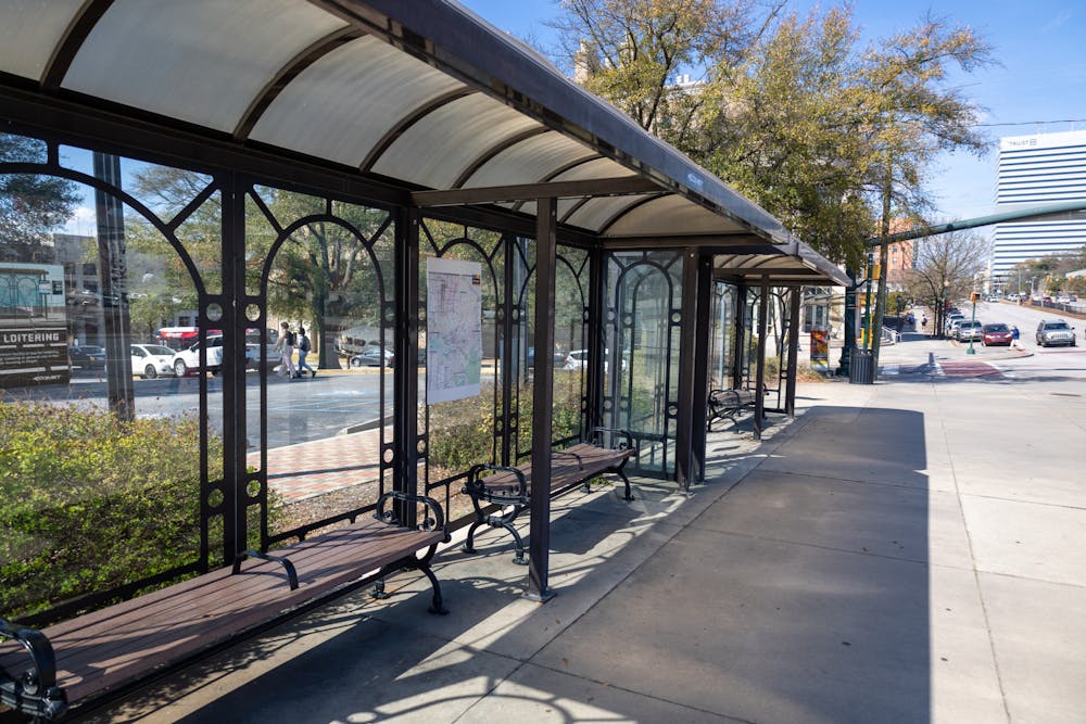 <p>Sitting at the intersection between Assembly Street and College Street, the Comet bus stop is seen with bars in the middle of the benches on Feb. 23, 2023. The extra bar is seen as a way for the local authorities to stop people from being able to lay down on the benches. &nbsp;</p>