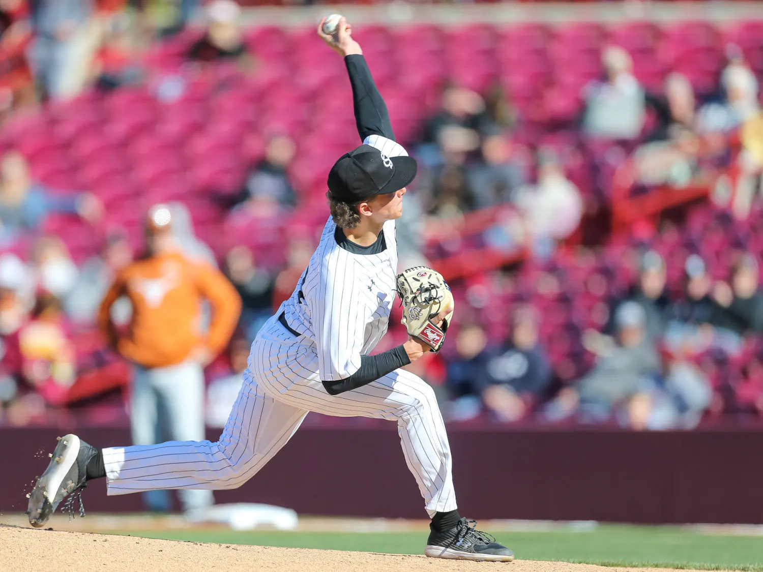 FILE— Freshman Left-Handed pitcher Matthew Becker pitches ball.